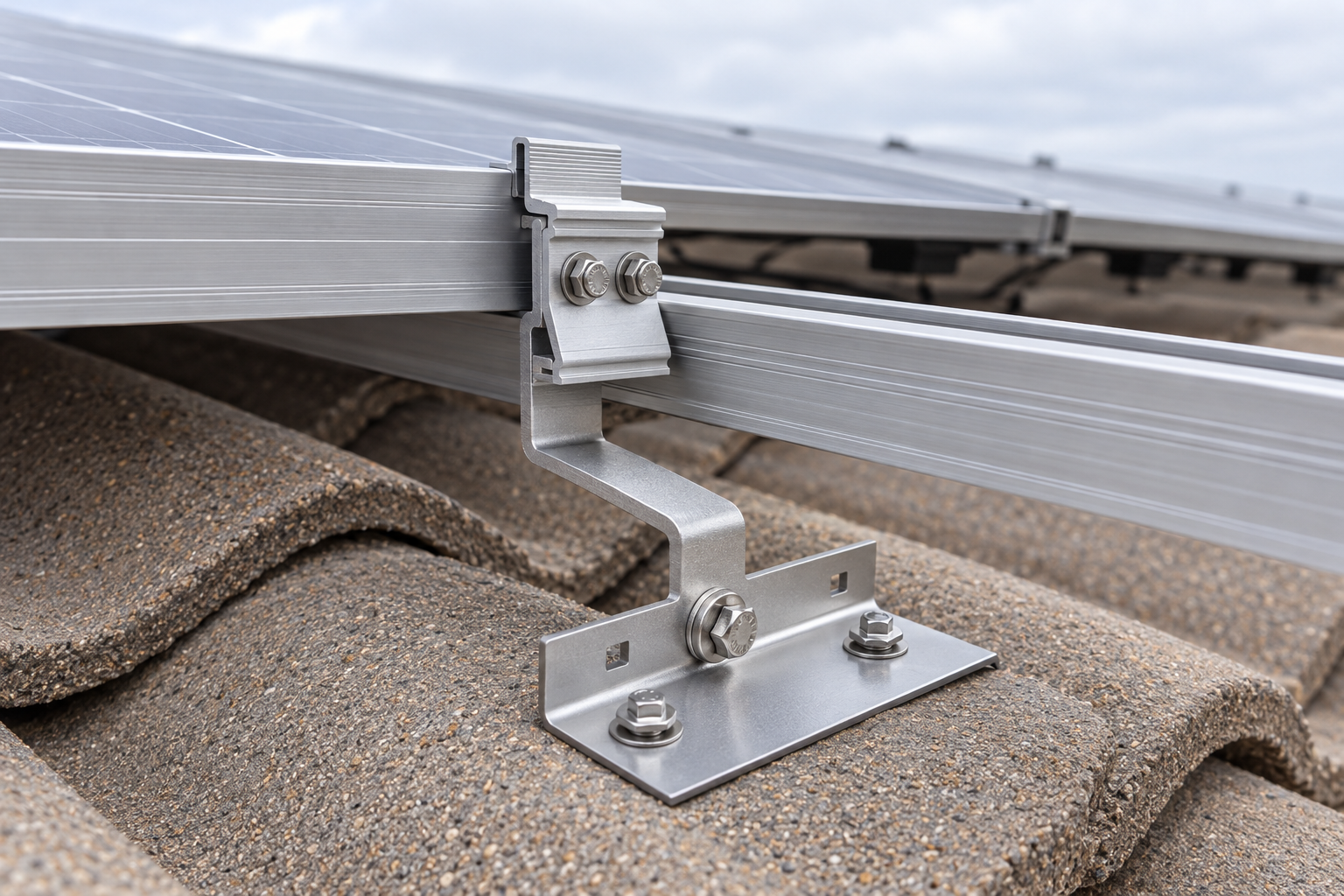 Solar panel frame clamped to a mounting rail on a flashed mount over a concrete roof tile
